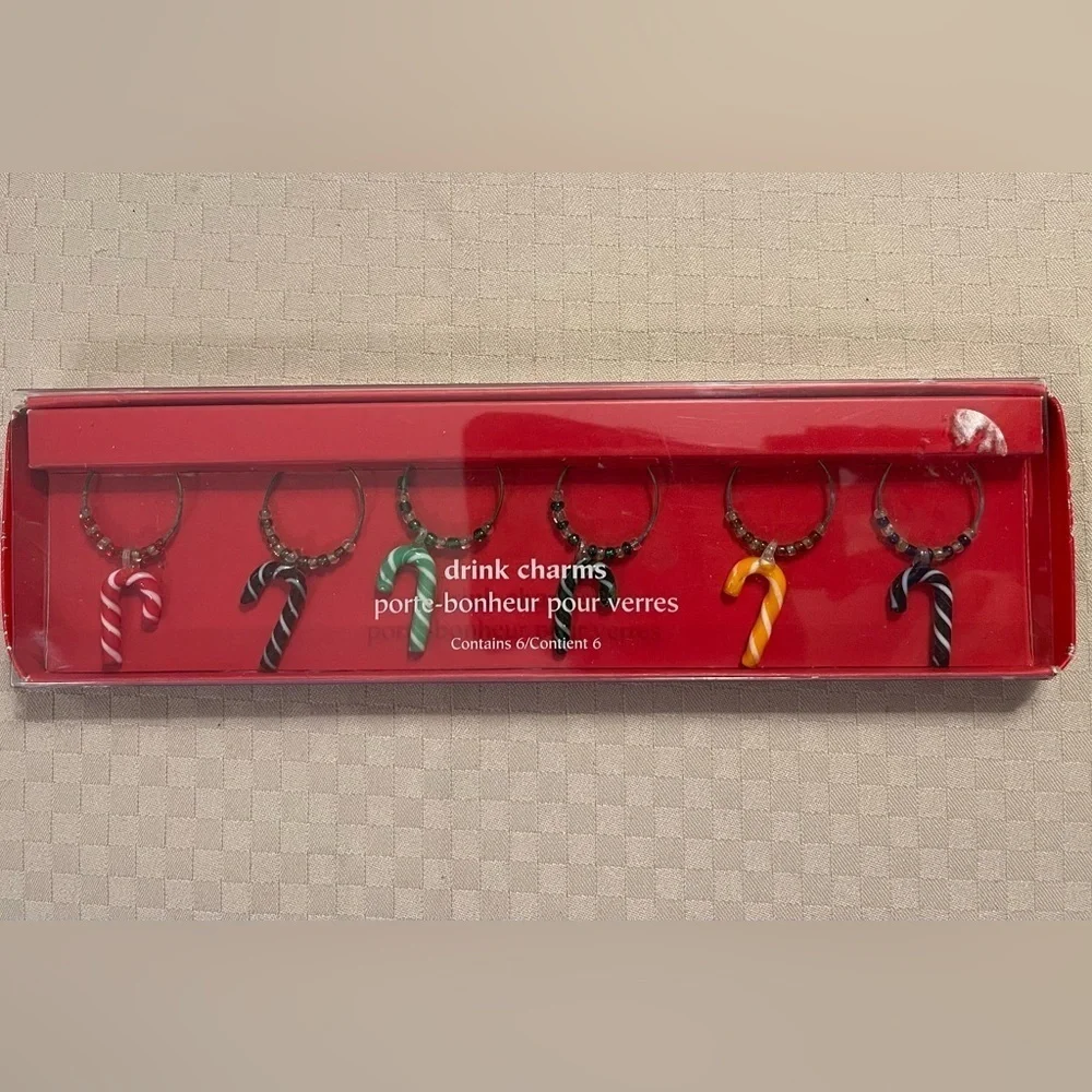 Pier 1 Imports multicolored glass candy cane drink charms in original box.